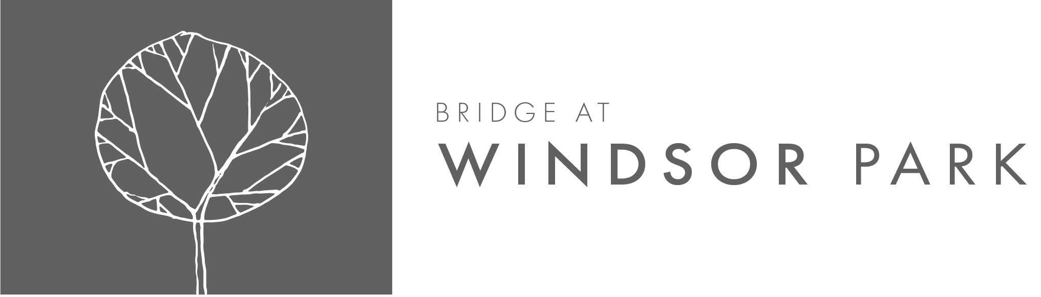 Property entrance sign with tree logo at Bridge at Windsor Park Apartments, Austin, TX